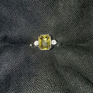 Deep Peridot With White Topaz On Irodium